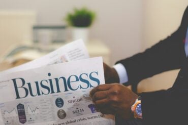 Business man holding paper