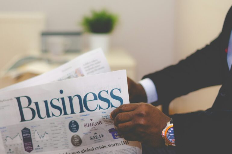 Business man holding paper